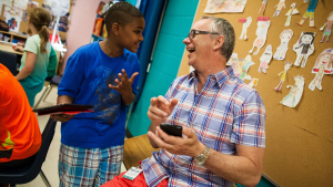 Student and teacher laughing [Google Edu]