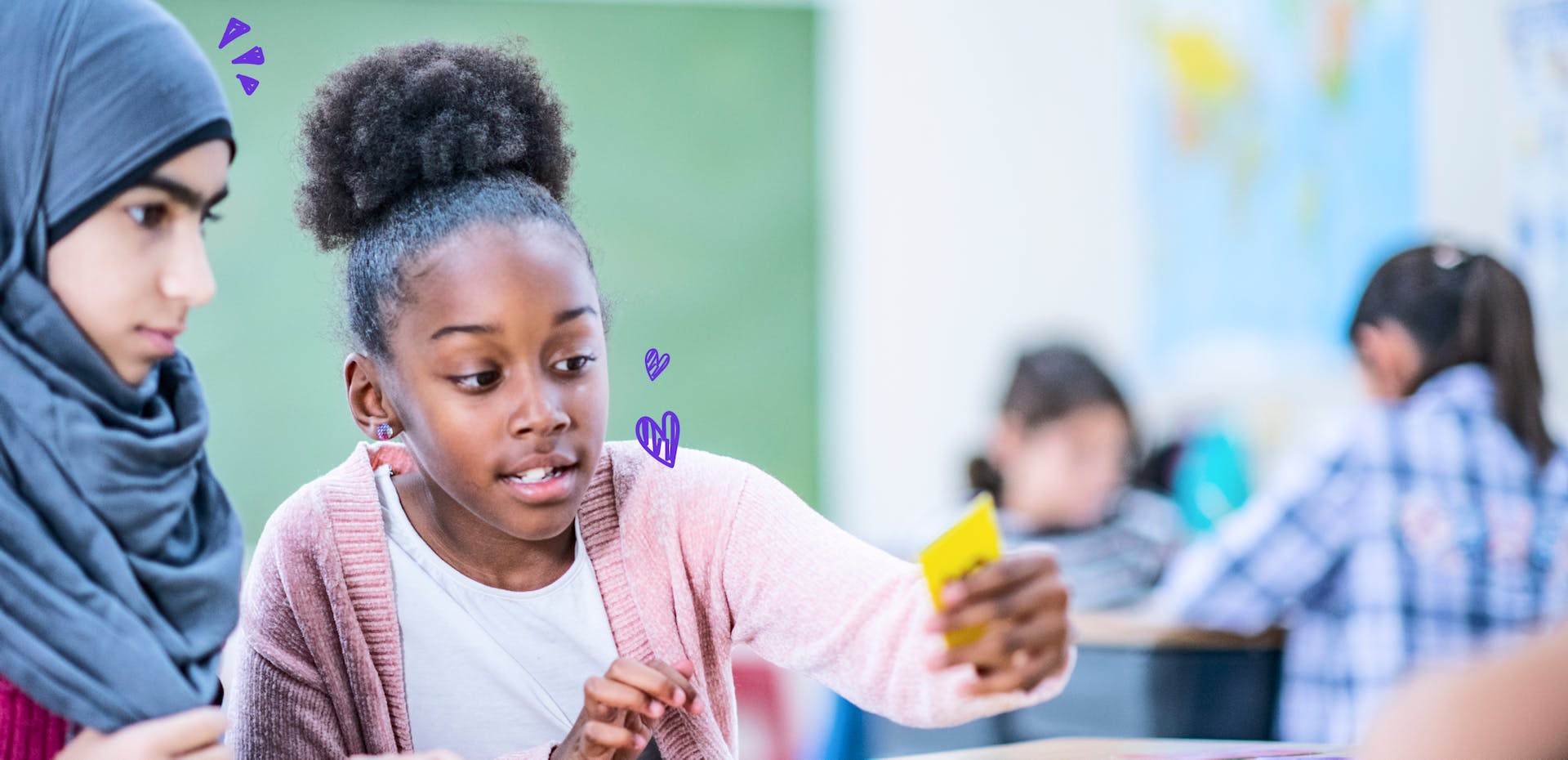 Two students working together in a classroom