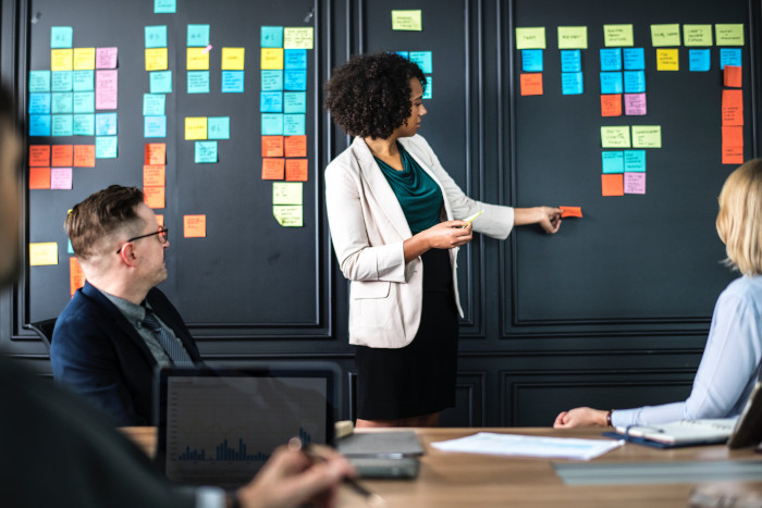 Adults brainstorming and briefing